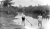 Crawford children playing in stream